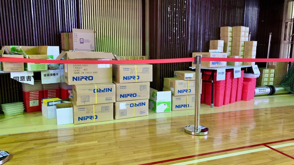 Boxes of supplies at the side of the room.
