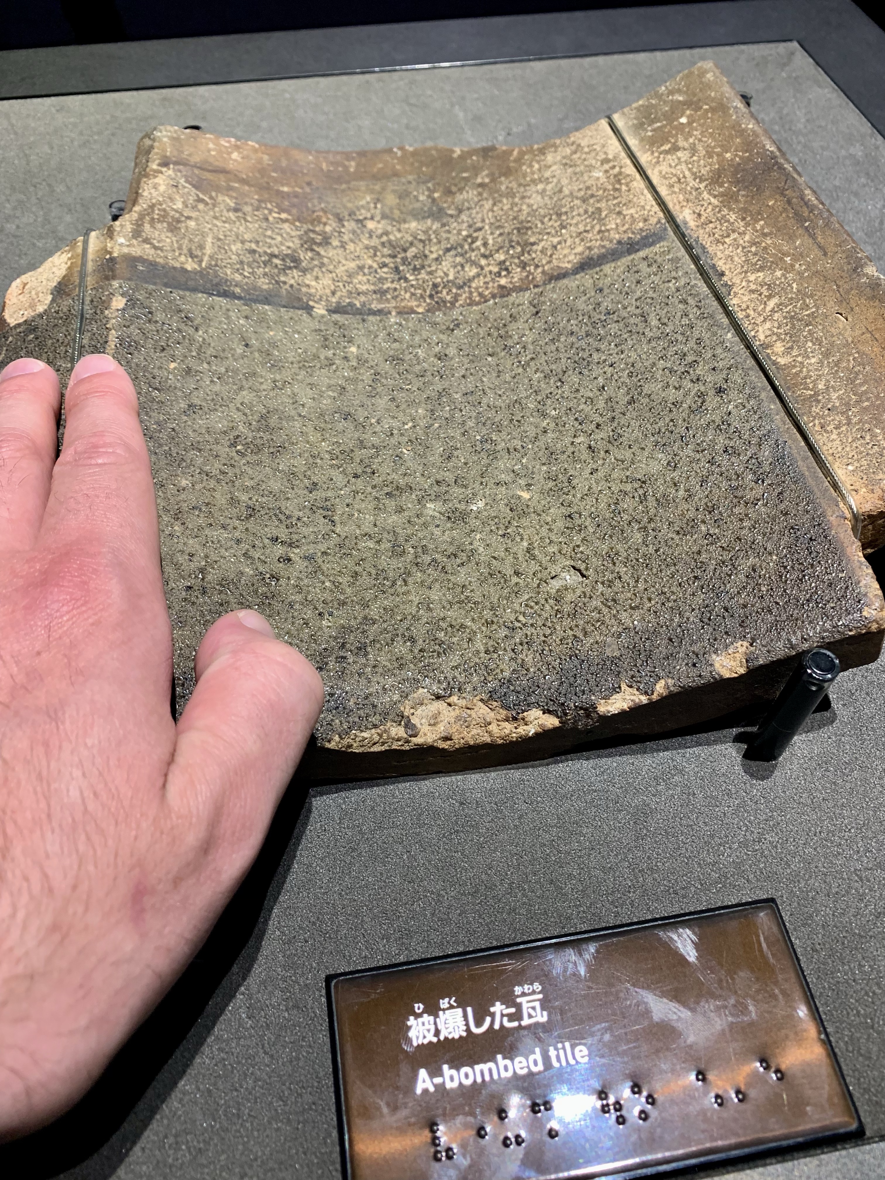 Roof tile partially melted by atomic blast