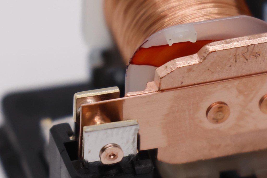 Close up fiew of the switch arm component of relay to show electrical contacts. 