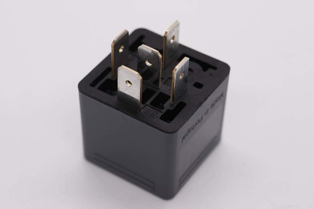 Underside of the relay with the electrical contacts. It's not visible here, but each is labeled with a standardized number. 